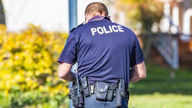 A Queensland Police Service officer conducts an investigation. Generic photo.