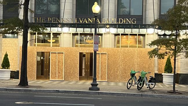 Boarded up windows on a building on Freedom Plaza in Washington. Picture: Keith Woods.