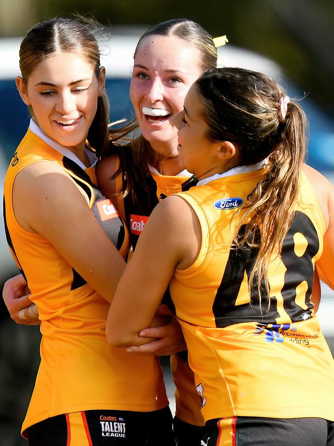 Georgia Templeton is congratulated by Sienna Shelton and Phoebe Pearce. (Photo by Josh Chadwick)