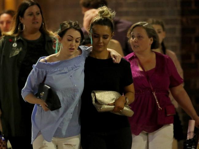 MANCHESTER, ENGLAND - MAY 23:  Police escort members of the public from the Manchester Arena on May 23, 2017 in Manchester, England.  There have been reports of explosions at Manchester Arena where Ariana Grande had performed this evening.  Greater Manchester Police have have confirmed there are fatalities and warned people to stay away from the area. (Photo by Christopher Furlong/Getty Images)