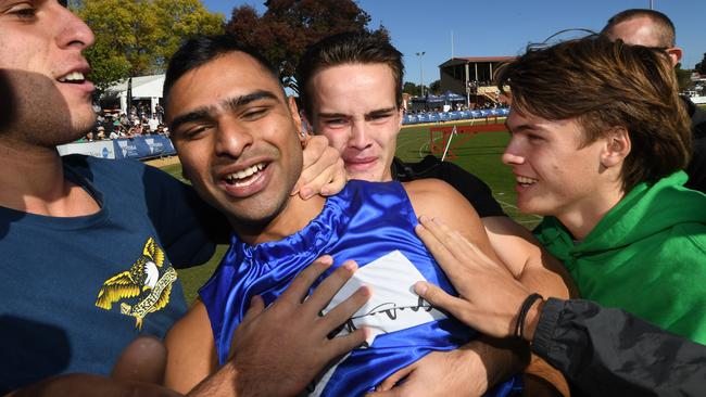 Dhruv Rodrigues Chico is swamped by his mates. Picture: AAP