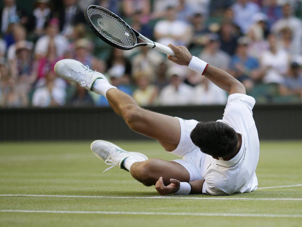 Serbia's Novak Djokovic takes a tumble. (AP Photo/Tim Ireland)