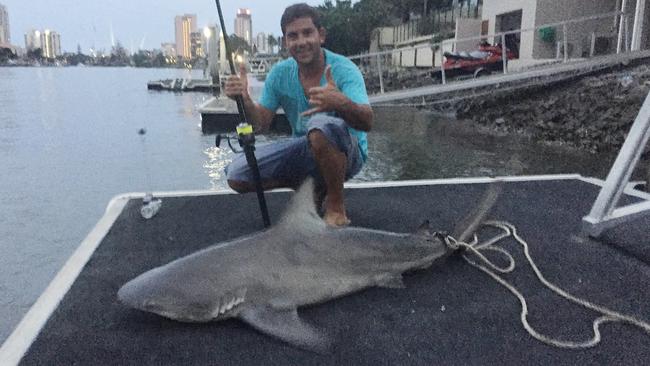 Nick Dinatale with the 1.5m bull shark he landed on Thursday night.