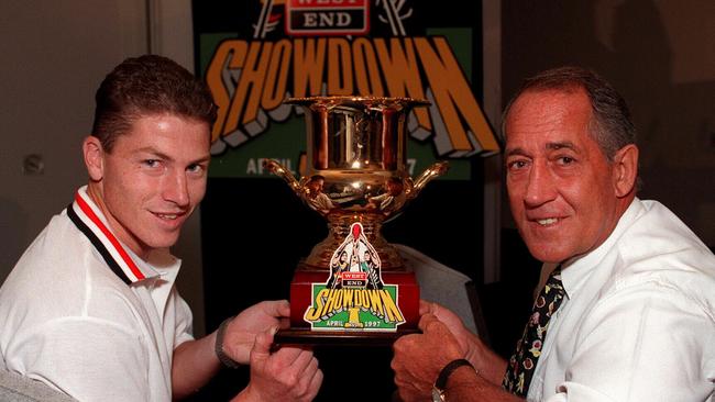 Then Crows captain Mark Bickley with then Port coach John Cahill with the Showdown I trophy in 1997.