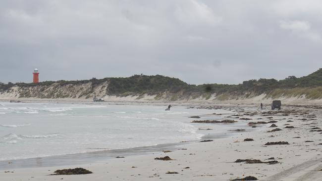 Two crayfishers who capsized off the coast of Carpenter Rocks retrieving a cray pot. Picture: Jessica Ball