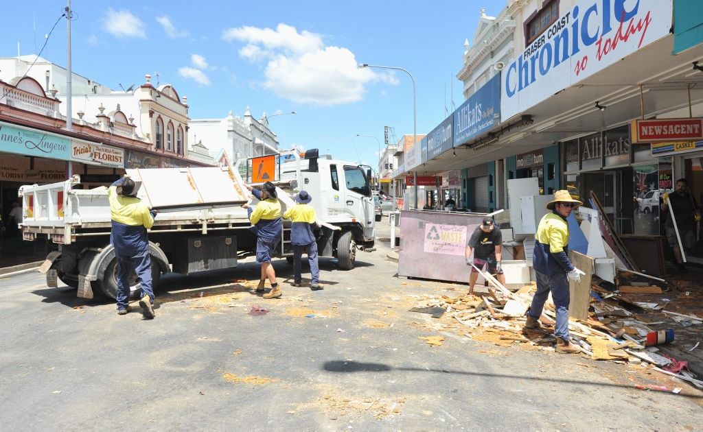 The flood clean up begins in Kent St with council workers clearing debris. Picture: Alistair Brightman