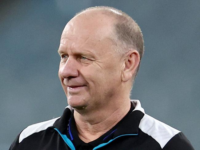 MELBOURNE, AUSTRALIA - AUGUST 10: Chad Cornes, Forwards Coach of the Power, Ken Hinkley, Senior Coach of the Power and Josh Carr, Midfield Coach of the Power look on prior to the round 22 AFL match between Melbourne Demons and Port Adelaide Power at Melbourne Cricket Ground, on August 10, 2024, in Melbourne, Australia. (Photo by Josh Chadwick/Getty Images)