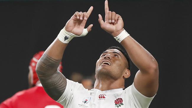 England's Manu Tuilagi reacts after scoring a try.