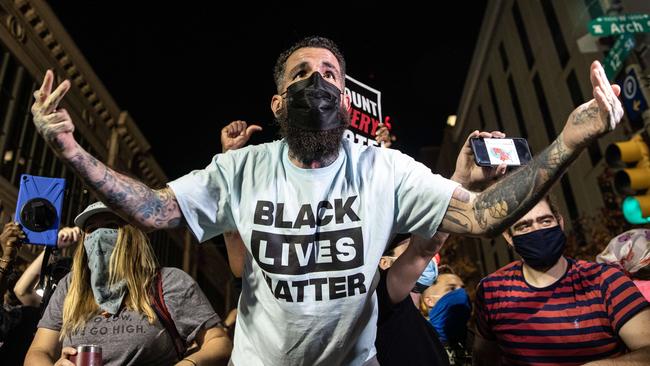 People celebrating the election victory of Joe Biden taunt Trump supporters while celebrating outside the Philadelphia Convention Center after Joe Biden was declared winner of the 2020 presidential election. Picture: Chris McGrath/Getty Images/AFP