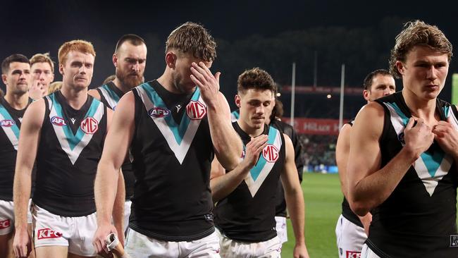 ADELAIDE, AUSTRALIA - JULY 29: Xavier Duursma and Trent McKenzie react as they walk off with the team after the loss during the 2023 AFL Round 20 match between the Adelaide Crows and the Port Adelaide Power at Adelaide Oval on July 29, 2023 in Adelaide, Australia. (Photo by Sarah Reed/AFL Photos via Getty Images)