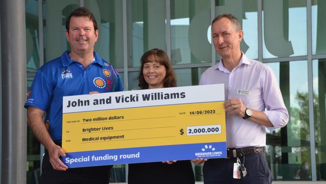 Townsville Hospital and Health Service CEO Kieran Keyes, director of medical services (rural and Indigenous) Matt Bryant and Brighter Lives CEO Tanya Busoli accept a cheque for $2 million