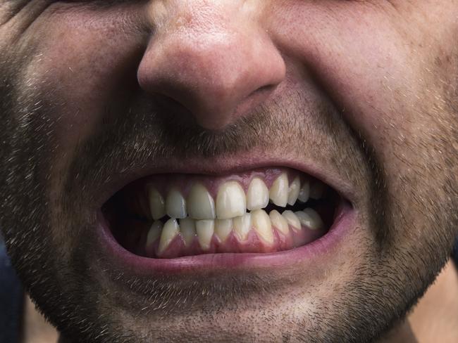 Closeup of mouth of very stressed man