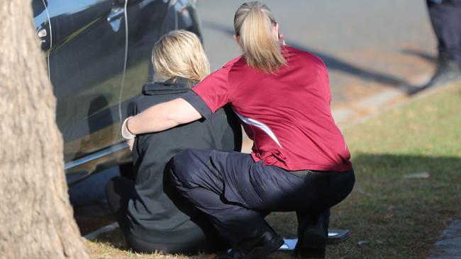 A woman is comforted at the scene of the incident. Picture: Peter Wallis