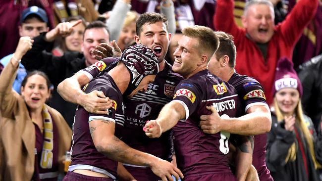 BRISBANE, AUSTRALIA - JUNE 05: Kalyn Ponga, Corey Oates, Cameron Munster and Michael Morgan of the Maroons celebrate victory after game one of the 2019 State of Origin series between the Queensland Maroons and the New South Wales Blues at Suncorp Stadium on June 05, 2019 in Brisbane, Australia. (Photo by Bradley Kanaris/Getty Images)