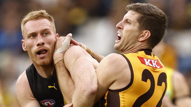 Nick Vlastuin tries to get the better of Luke Breust. Picture: Darrian Traynor/AFL Photos/via Getty Images