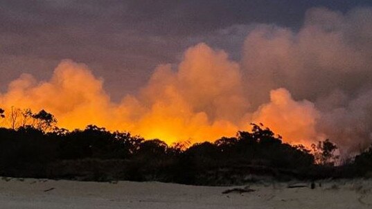 A fire broke out on Moreton Island near the township of Cowan Cowan late on Saturday afternoon. Picture: Angela Topatig