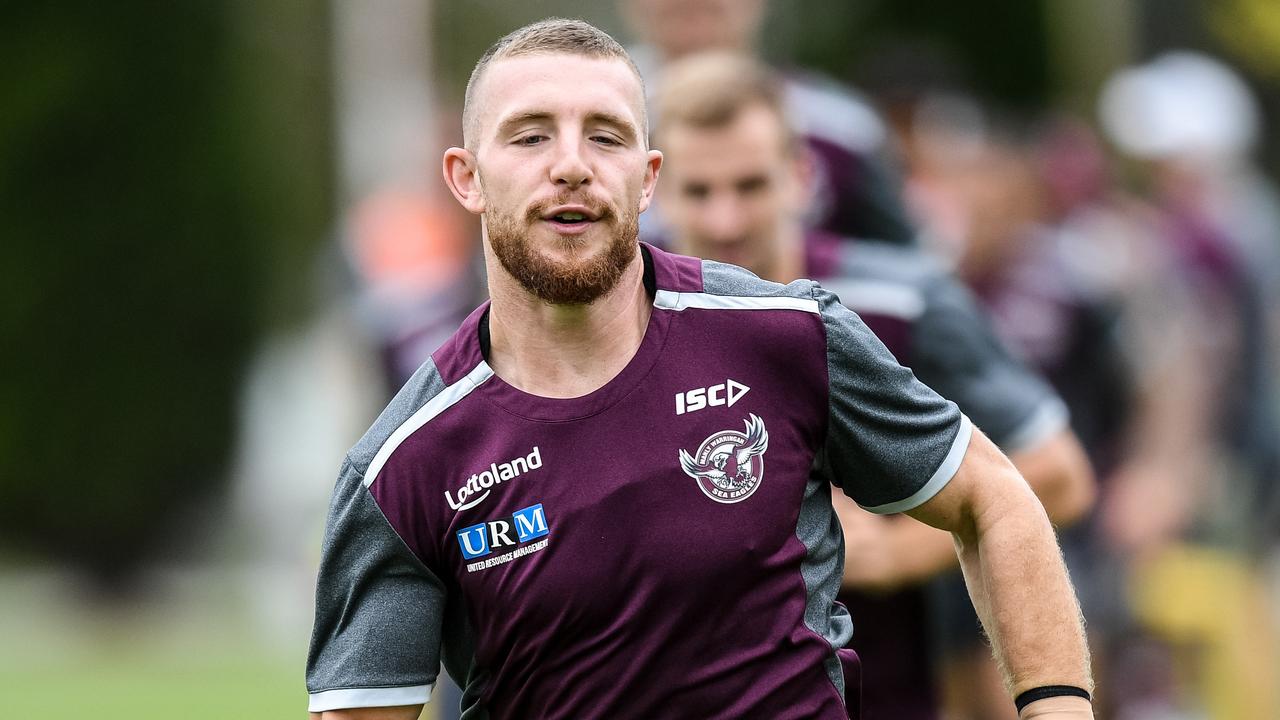 Manly-Warringah Sea Eagles player Jackson Hastings (centre) is seen warming up during a team training session in Sydney, Tuesday, April 3, 2018. (AAP Image/Brendan Esposito) NO ARCHIVING