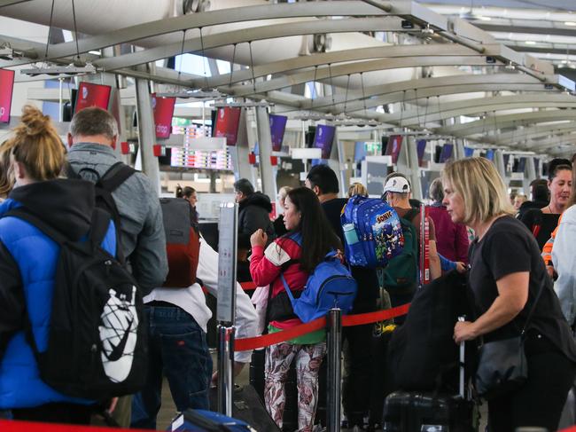 SYDNEY, AUSTRALIA - Newswire Photos - JULY 03 2023: A general view of Sydney Domestic Airport on the first day of school holidays which sees cancellations and delays of some flights due to poor weather and queues of people in Sydney. Picture : NCA Newswire / Gaye Gerard