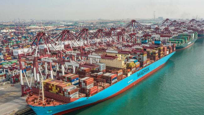 A cargo ship berthing at a port in Qingdao in China's eastern Shandong province. Australian agricultural exports into China lifted 8 per cent last season. Picture: STR / AFP.