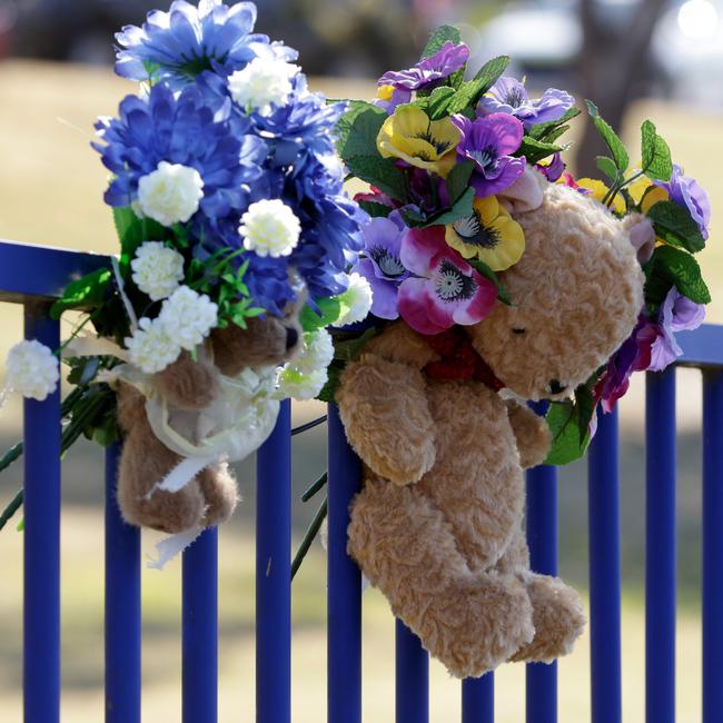 Flowers and a teddy bear are among tributes at Hillcrest Primary School in Devonport. Picture: Grant Viney