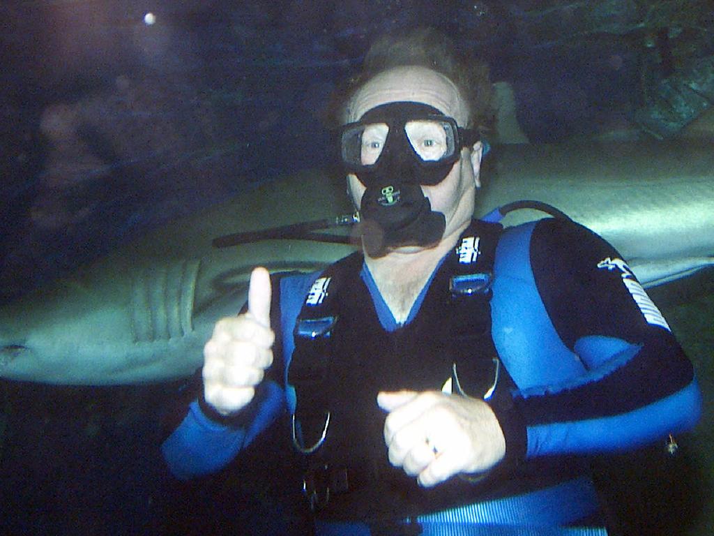Queensland Premier Peter Beattie swimming with the sharks at Underwater World, Mooloolaba.