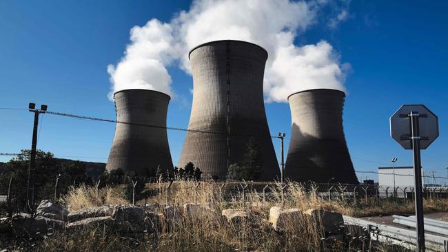 Steam rises from the cooling towers of the Bugey nuclear power plant in Saint-Vulbas, central France. Australia has many legislative and economic hurdles to cross before planning a pathway for nuclear energy. Photo: AFP