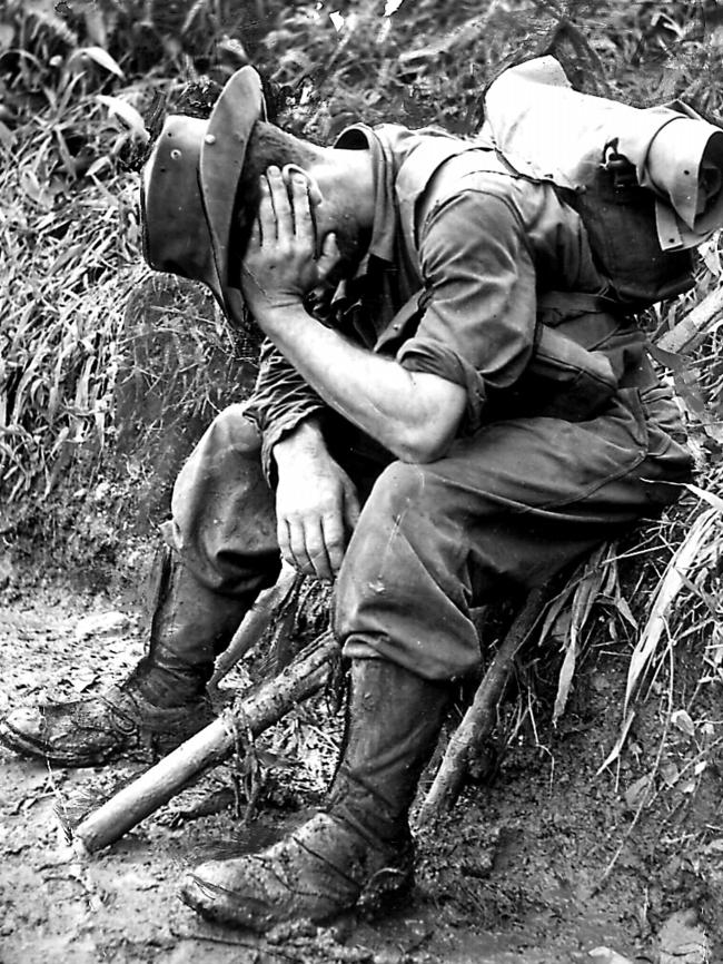 An Australian Army soldier takes a break on the gruelling New Guinea track.