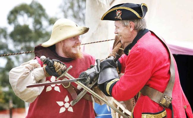 Norm Kaden (left) and Sir Antony Dealbern of the Caribbean Trading Co in Ipswich battle it out at the Fernvale Environmental and Heritage Festival. . Picture: David Nielsen