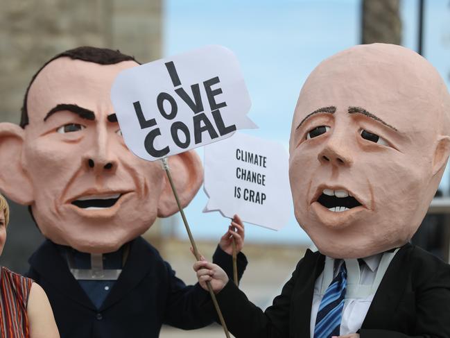 10.4.2019.GetUp members will be joined by National Director Paul Oosting and celebrated childrens entertainer Peter Coombe at Moseley Square,Glenelg calling for politicians to show climate leadership in securing a future for our kids.Giant Peter Dutton and Tony Abbott heads. PIC TAIT SCHMAAL.