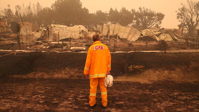 CFA fire chief Steve Warrington surveys the fire damage in Buchan. Picture: David Crosling