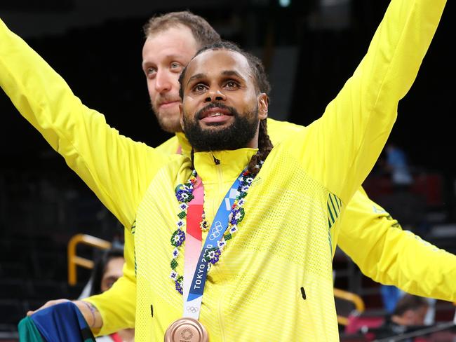 SAITAMA, JAPAN - AUGUST 07: Patty Mills of Team Australia celebrates with his bronze medal during the Men's Basketball medal ceremony on day fifteen of the Tokyo 2020 Olympic Games at Saitama Super Arena on August 07, 2021 in Saitama, Japan. (Photo by Kevin C. Cox/Getty Images)