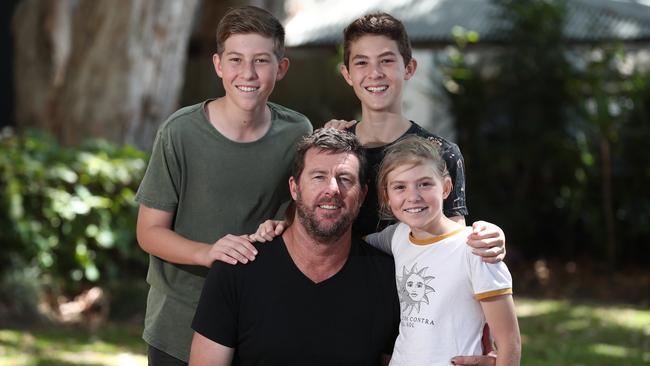 David Wood celebrates Father's Day with his children Geordie, 14, Charlie, 12, and Amelia, 10, at the Palm Cove markets. PICTURE: BRENDAN RADKE