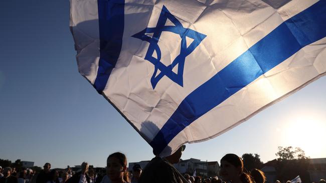 Members of the Australian Jewish community hold a vigil in Sydney.