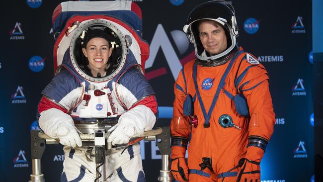 The two NASA spacesuit prototypes for lunar exploration, one for launch and re-entry aboard the agency's Orion spacecraft, is worn by Dustin Gohmert, right, and one for exploring the surface of the Moon's South Pole, is worn by Kristine Dans, left Picture: AP