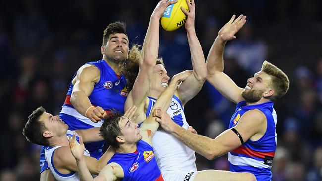 Ben Brown takes a strong mark in a pack of Dogs players. Picture: Getty Images