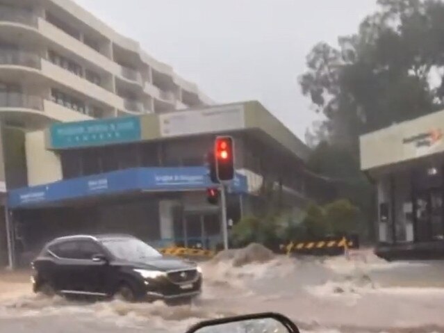 Flash flooding across Pittwater Rd in the Dee Why CBD on Thursday morning disrupted peak hour traffic. Picture: Dale Drinkwater (Twitter)