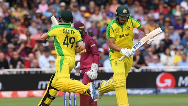 Australia’s Steve Smith and Nathan Coulter-Nile run between the wickets during their World Cup rescue mission against the West Indies at Trent Bridge. Picture: AFP