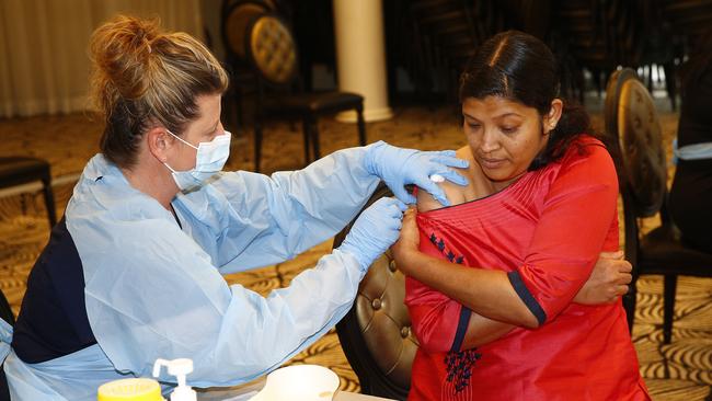 Nurse Melanie Broadbent gives Akhila Bose a flu jab. Picture: John Appleyard