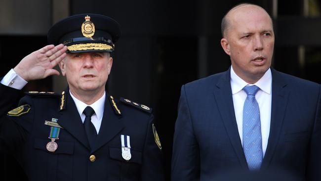 Michael Outram being sworn in as Australian Border Force Commissioner with Minister for Home Affairs Peter Dutton in Canberra. Picture: Gary Ramage.