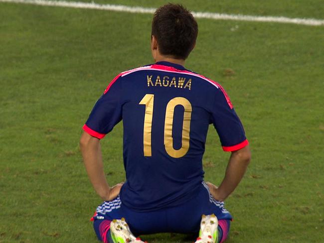 Japan crash out, Iraq win thriller