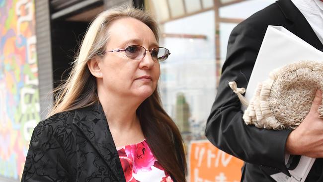 Jenny Hallam walks from the District Court with her lawyer after facing sentencing submissions. Picture: David Mariuz/AAP