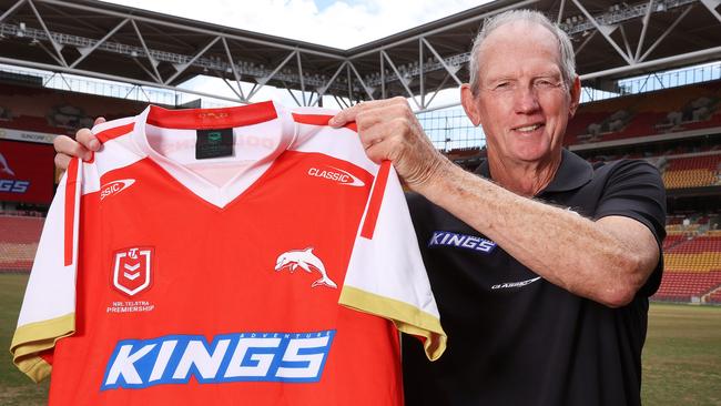 Coach Wayne Bennett holding the first Dolphins jersey. Picture: Liam Kidston.