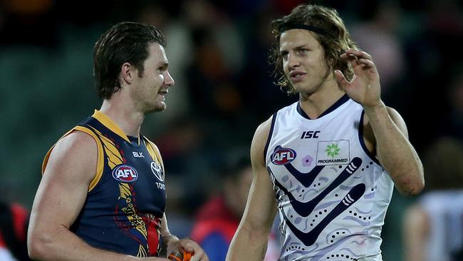 Patrick Dangerfield and Nat Fyfe chat after the game. Picture: Simon Cross