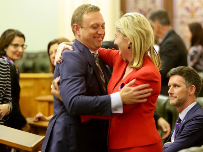 Health Minister Steven Miles embraces Member for Waterford Shannon Fentiman after the vote. Picture: Steve Pohlner/AAP