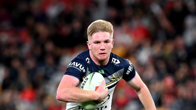 BRISBANE, AUSTRALIA - AUGUST 25: Tom Dearden of the Cowboys breaks away from the defence during the round 26 NRL match between Dolphins and North Queensland Cowboys at Suncorp Stadium on August 25, 2023 in Brisbane, Australia. (Photo by Bradley Kanaris/Getty Images)