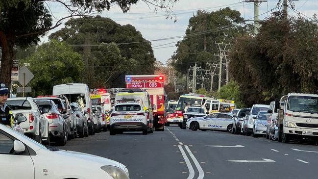 A large contingent of emergency services personnel remained at the scene just before 7pm. Picture: Amaani Siddeek