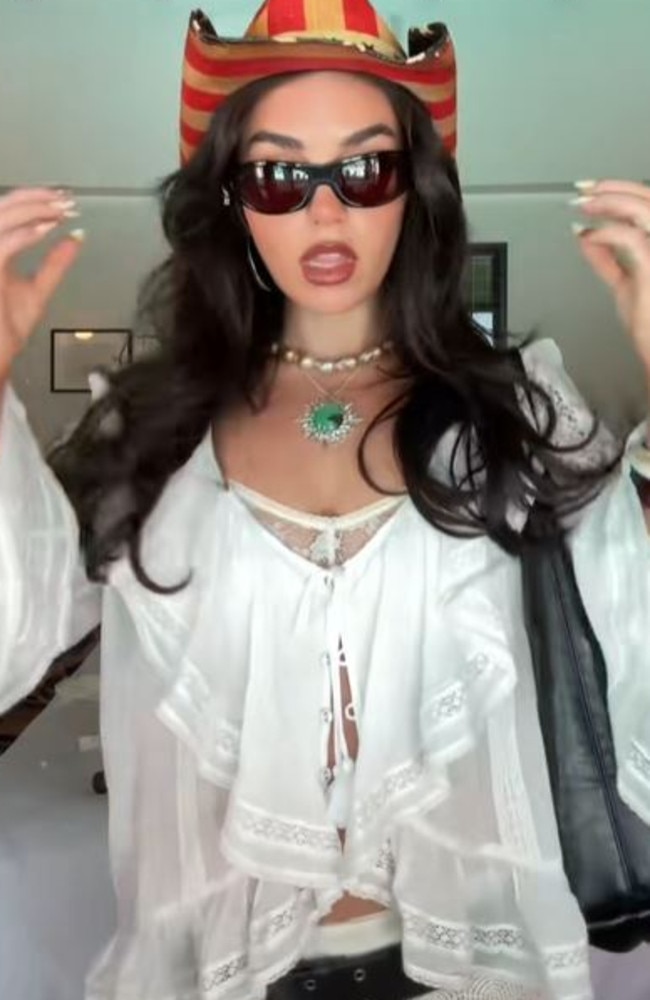 Mallan embraced the country music fashion, donning an American flag cowboy hat to see Lana Del Ray. Picture: TikTok/Cartia Mallan