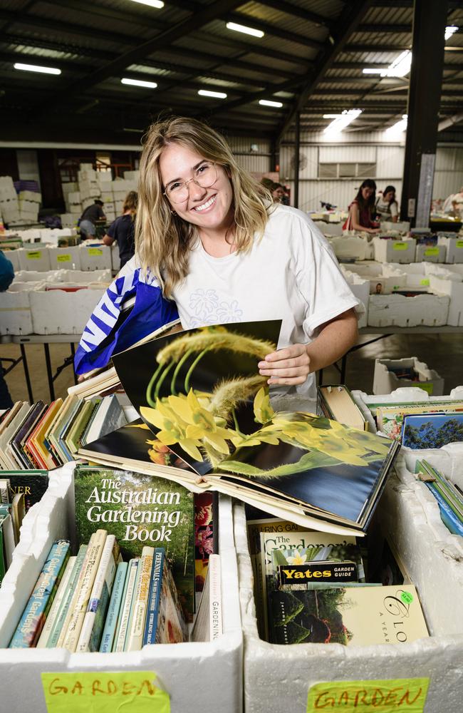 Florist Belle Clark checks out The Chronicle Lifeline Bookfest after recently relocating to the city, Saturday, March 1, 2025. Picture: Kevin Farmer