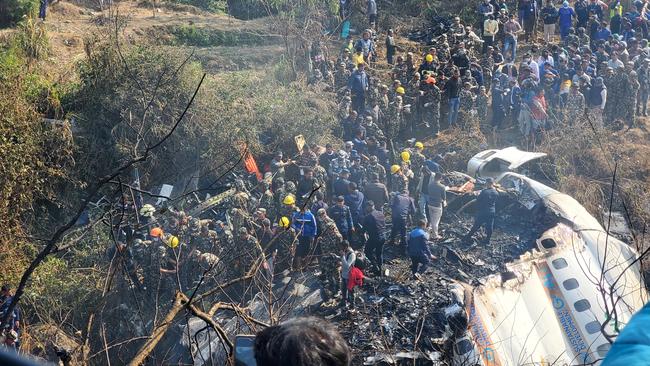 A general view of people gathered after the plane crash in Pokhara, Nepal. Picture: Naresh Giri/via Reuters