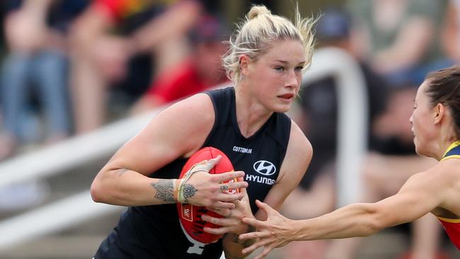 ADELAIDE, AUSTRALIA - MARCH 01: Tayla Harris of the Blues evades Sophie Li of the Crows  during the 2020 AFLW Round 04 match between the Adelaide Crows and the Carlton Blues at Hisense Stadium on March 1, 2020 in Adelaide, Australia. (Photo by Matt Turner/AFL Photos via Getty Images)